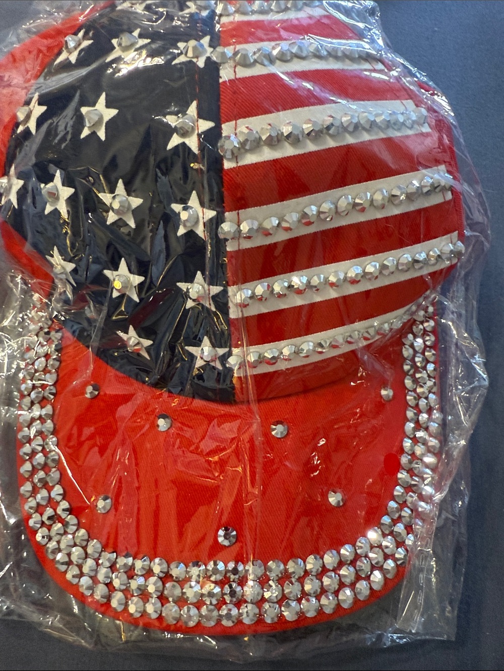 NWTs Red USA bedazzled flag cap with adjustable strap.